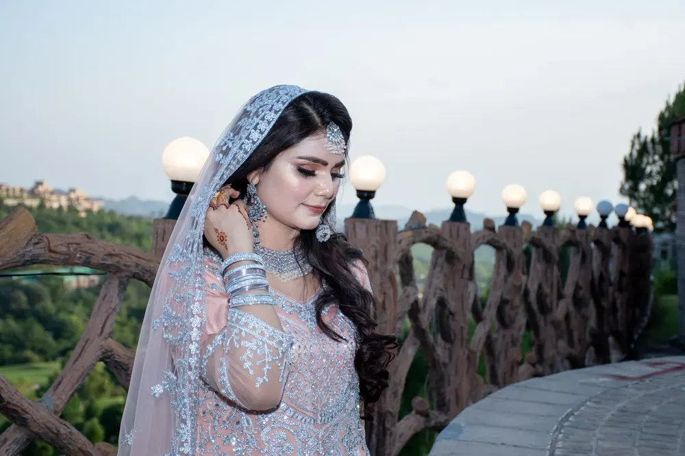 A bride in a light blue dupatta